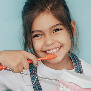 a young girl smiling at services