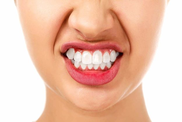 how do i stop grinding my teeth (1) girl wondering How Do I Stop Grinding My Teeth