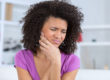 woman in pain wondering how does tooth decay develop