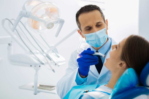 dental emergency (2) a woman sees a dentist for a dental emergency