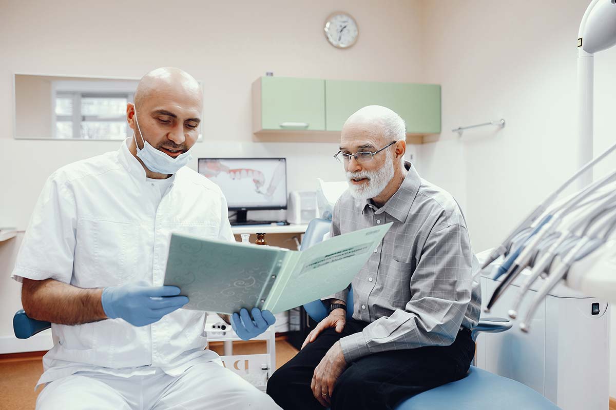 dentist explaining dental implants