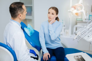 woman in need of root canal treatment 