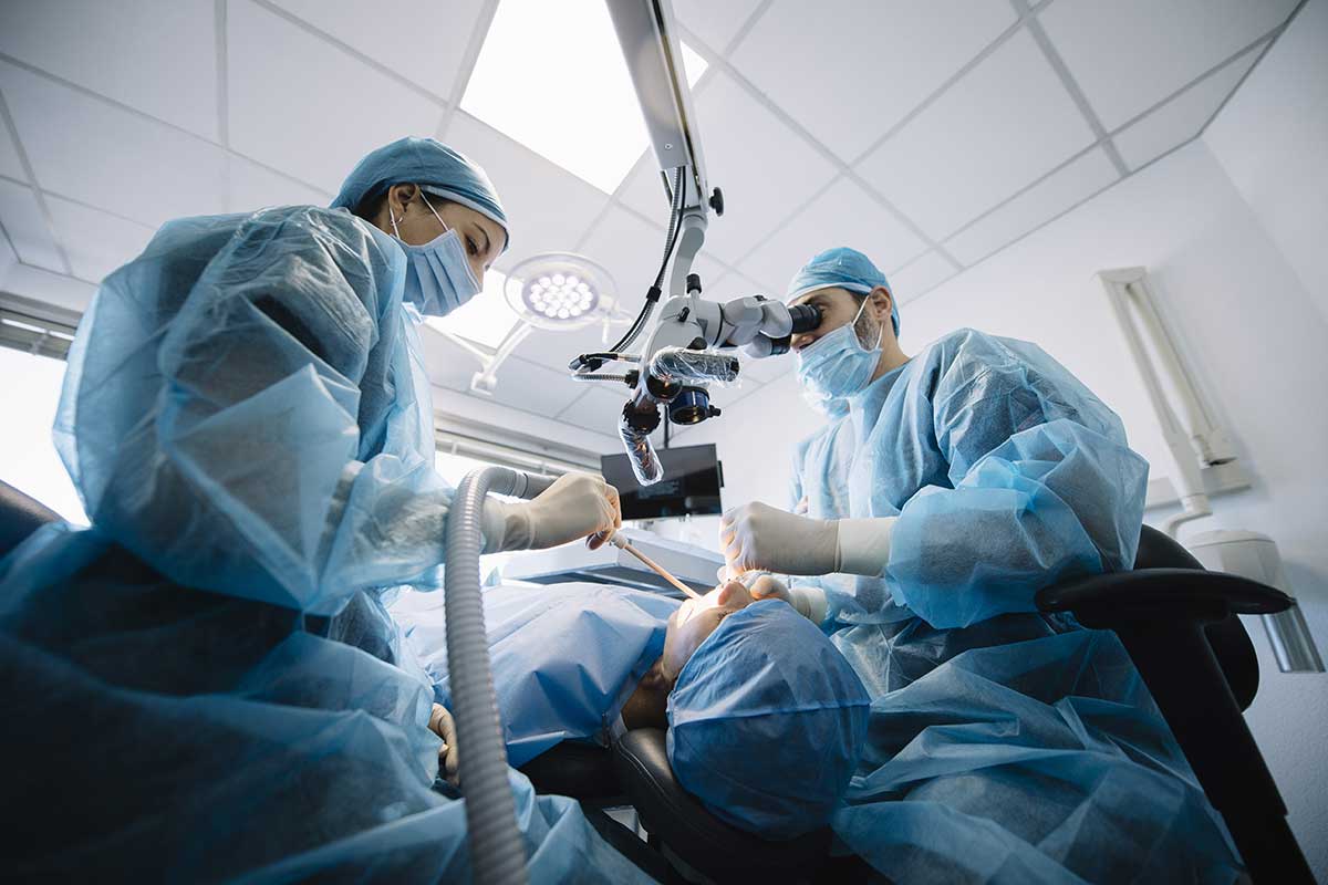 surgeons performing oral surgeries